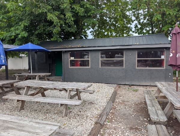 Feed The Obsession BBQ storefront and patio in DeLand, FL